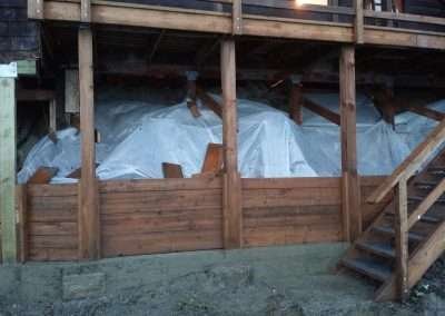 Completed renovation work on a house with new wooden supports.