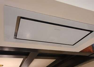 A sleek ceiling vent is seamlessly integrated into the modern kitchen design.