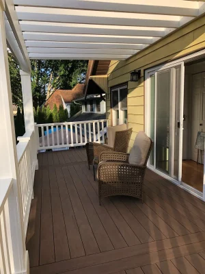 Beautifully designed elevated deck with a white pergola and outdoor seating, built by expert deck contractors in Seattle for a stylish and relaxing outdoor space.