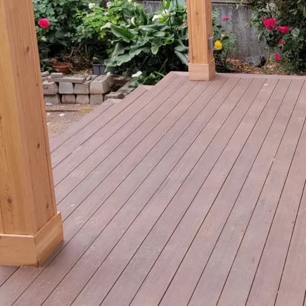 Bright white bathroom featuring subway tile, pedestal sink, wood countertop, and transom windows