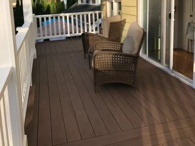 eautifully designed elevated deck with a white pergola and outdoor seating, built by expert deck contractors in Seattle for a stylish and relaxing outdoor space.