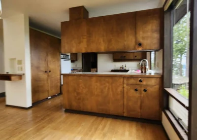 mage Title mercer-island-kitchen-cabinets-before Alt Text Dated wood cabinets blocking the view and light before a kitchen remodel on Mercer Island.