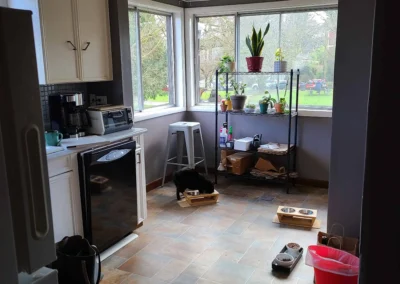 Full view of the original closed-off Redmond kitchen before remodel with dated cabinets, tile floor, and dropped ceiling